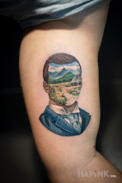 Tattoo Portret in colorful motif and surrealistic style on the forearm