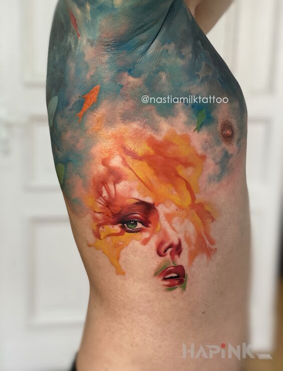 Tattoo Portret in faces motif and abstract style on the ribs