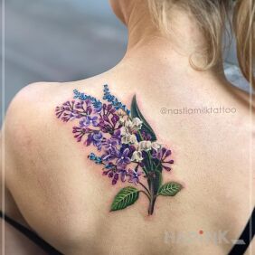 Tattoo Lilac branch with lily of the valley on the back motif: nature style: realistic