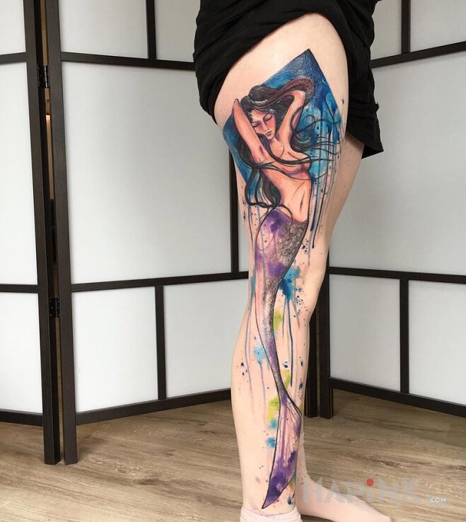 Tattoo Syrena in characters motif on the leg