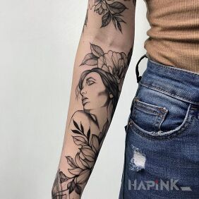Tattoo Woman surrounded by flowers on the forearm motif: black and gray style: graphic / illustrative