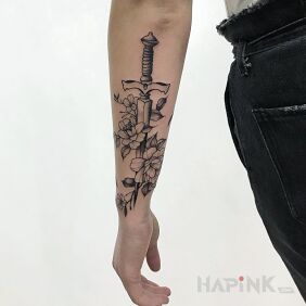 Tattoo Dagger on the forearm motif: objects style: dotwork