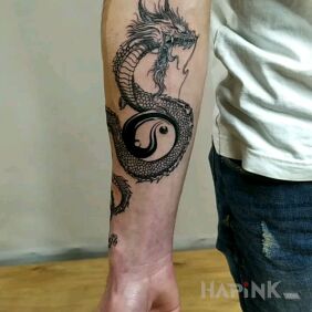 Tattoo Dragon on the forearm motif: black and gray style: graphic / illustrative