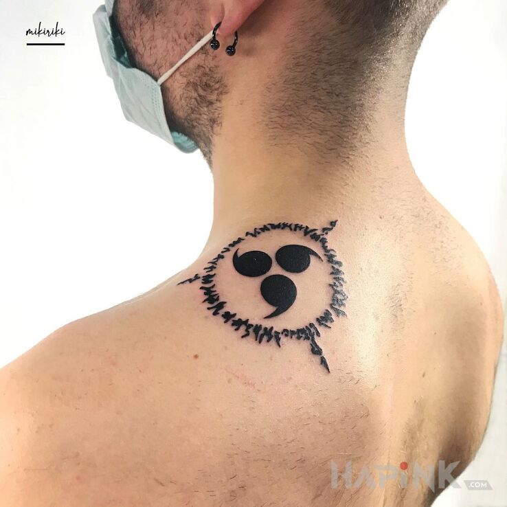 Tattoo Pieczęć in manga / anime motif and blackwork / blackout style on the upper arm