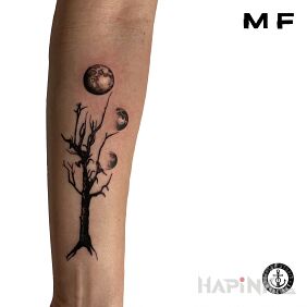 Tattoo Tree with moons on the forearm motif: other style: graphic / illustrative