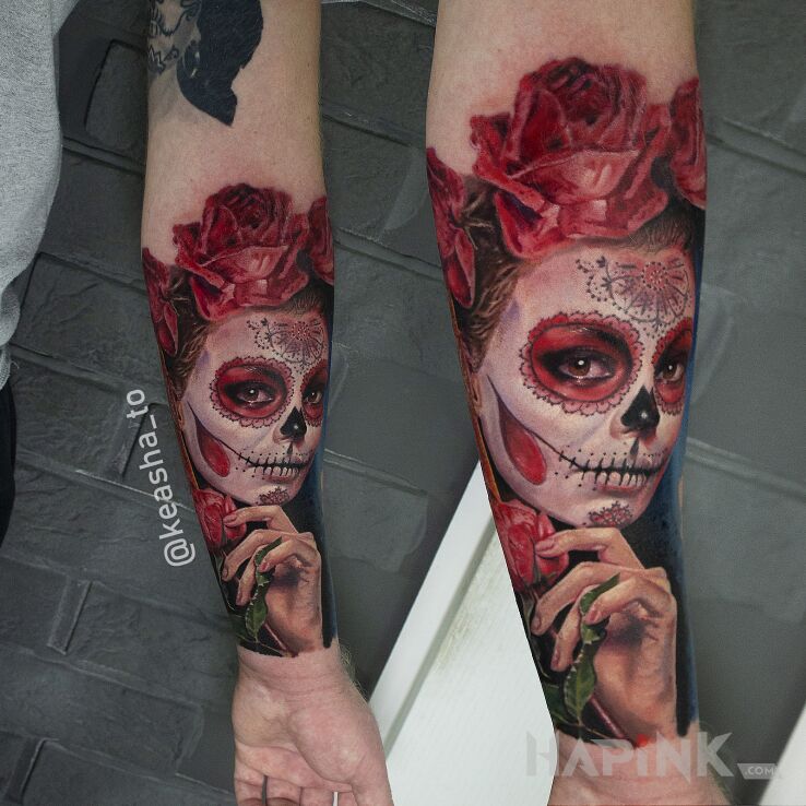 Tattoo Muerte in faces motif and realistic style on the forearm