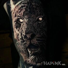 Tattoo Dark tiger on the upper arm motif: black and gray style: realistic