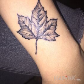 Tattoo Leaf on the wrist motif: black and gray style: graphic / illustrative