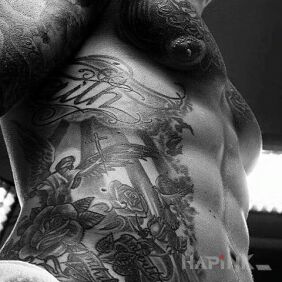 Tattoo Mrr but a tummy on the ribs motif: religious