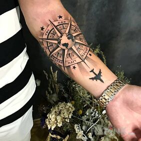 Tattoo Travels on the forearm motif: black and gray style: graphic / illustrative