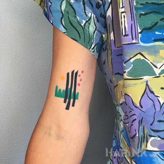 Tattoo Zielona trawka in colorful motif and abstract style on the upper arm