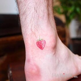 Tattoo Little Strawberry near the ankle motif: colorful style: minimalistic