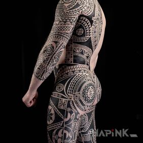 Tattoo Polynesian perfection on the back motif: legsleeves style: Polynesian