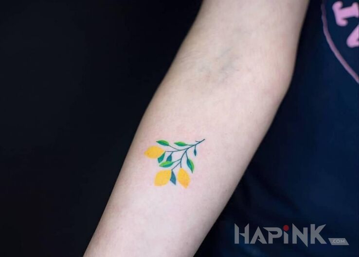 Tattoo Trzy cytryny in colorful motif and graphic / illustrative style on the forearm