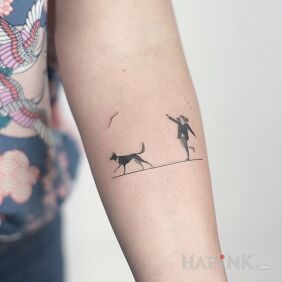 Tattoo Fetch on the forearm motif: black and gray style: minimalistic