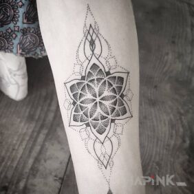 Tattoo Dotted mandala on the forearm motif: ornaments style: graphic / illustrative