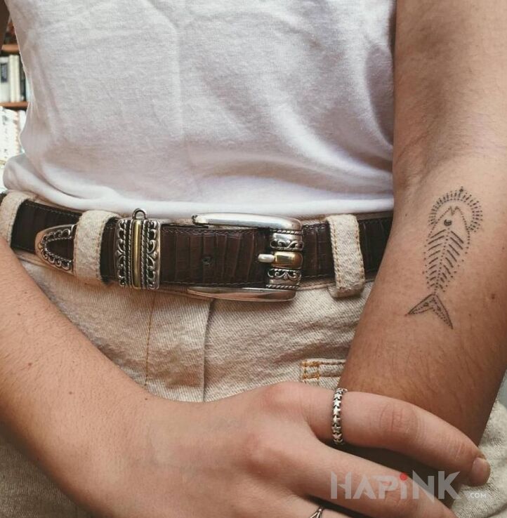 Tattoo Szkielet ryby in black and gray motif and handpoke style on the forearm