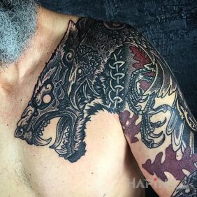 Tattoo Wolfhound on the chest motif: black and gray style: graphic / illustrative