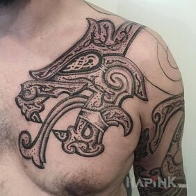 Tattoo Dragon head on the chest motif: fantasy style: Celtic / Nordic