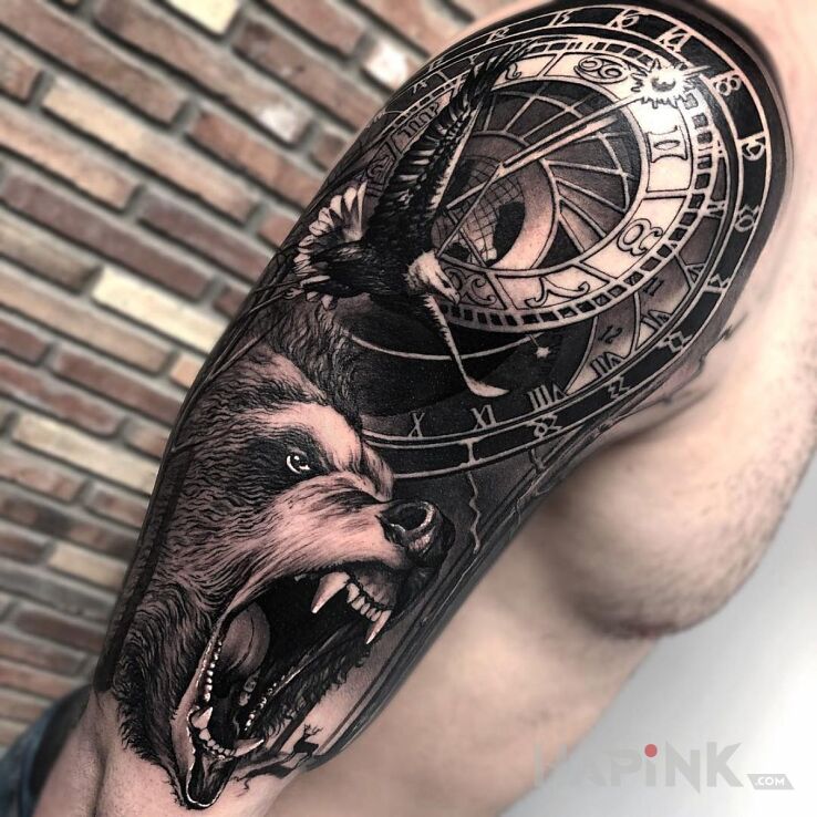 Tattoo Czas misia nastał in animals motif and realistic style on the upper arm