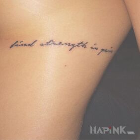 Tattoo Find strength in pain on the ribs motif: lettering style: calligraphy