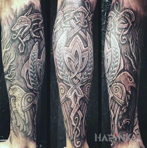Tattoo Kruki Odyna in fantasy motif and carved wood style on the calf