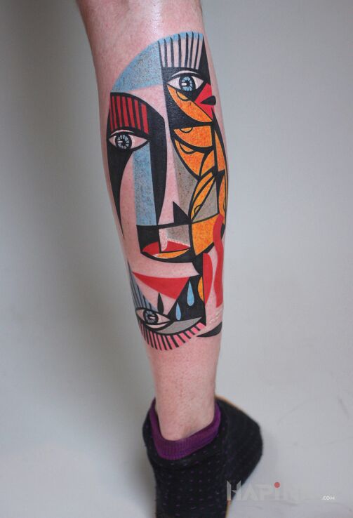Tattoo Kubistyczna twarz in colorful motif and modern / cubism style on the calf