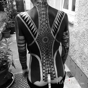 Tattoo Black suit on the back motif: sleeves style: geometric