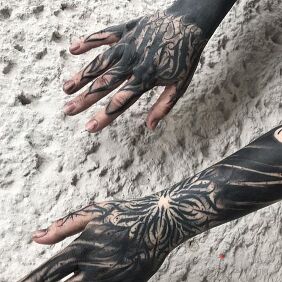 Tattoo Hands in the dark on the forearm motif: black and gray style: calligraphy