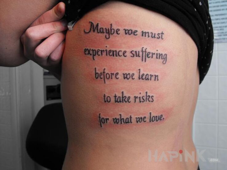 Tattoo Podjecie ryzyka dla milosci in lettering motif and calligraphy style on the ribs