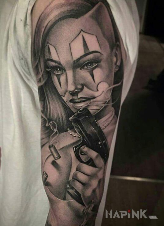 Tattoo Pif paf in black and gray motif and realistic style on the upper arm
