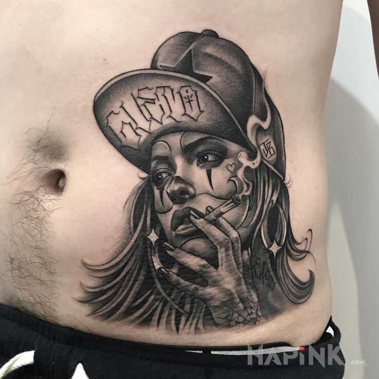 Tattoo Laska z fajką in faces motif and realistic style on the stomach
