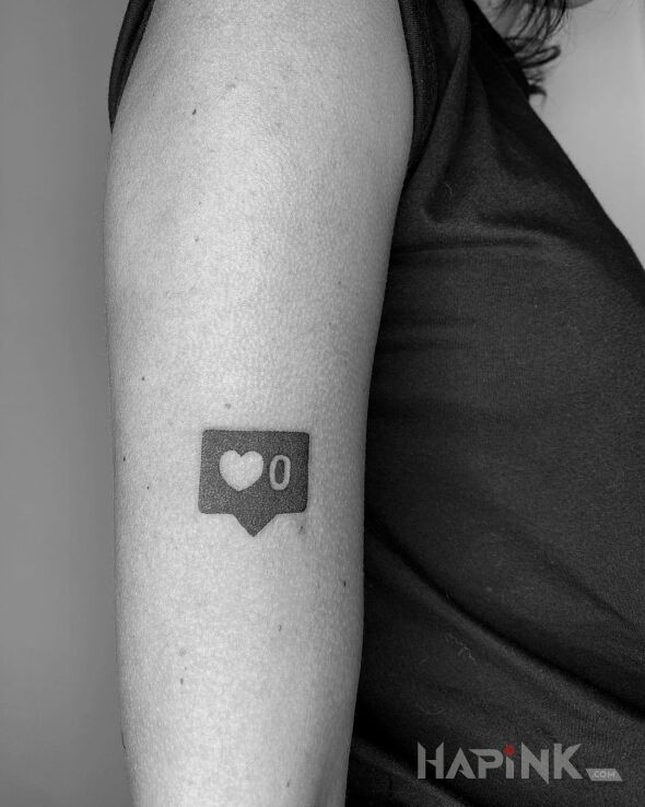 Tattoo 0 serduszek in black and gray motif and minimalistic style on the upper arm