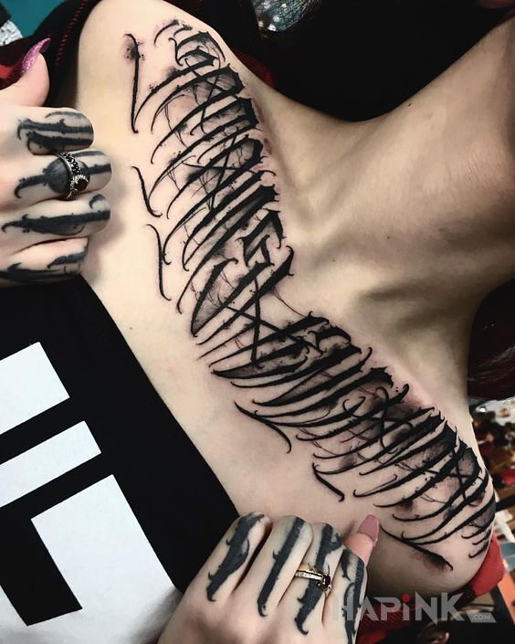Tattoo Satans henchman in lettering motif and calligraphy style on the chest