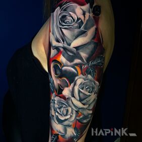 Tattoo Rose on the upper arm motif: colorful style: realistic