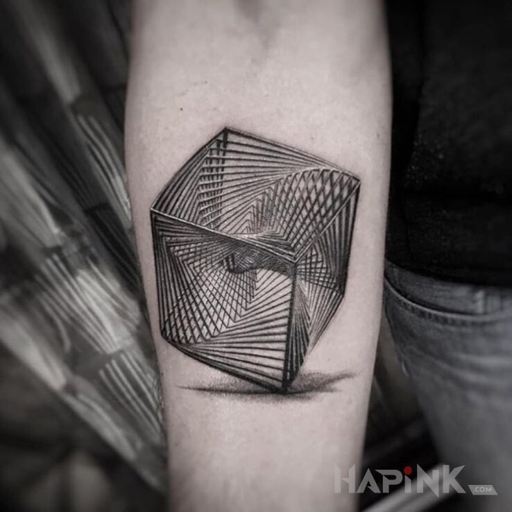 Tattoo Fajna kostka in objects motif and optical illusion style on the forearm