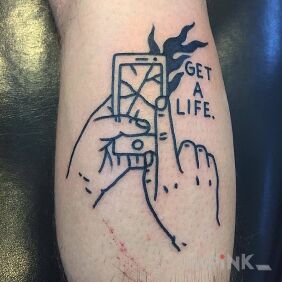 Tattoo Get a life. on the calf motif: lettering style: ignorant