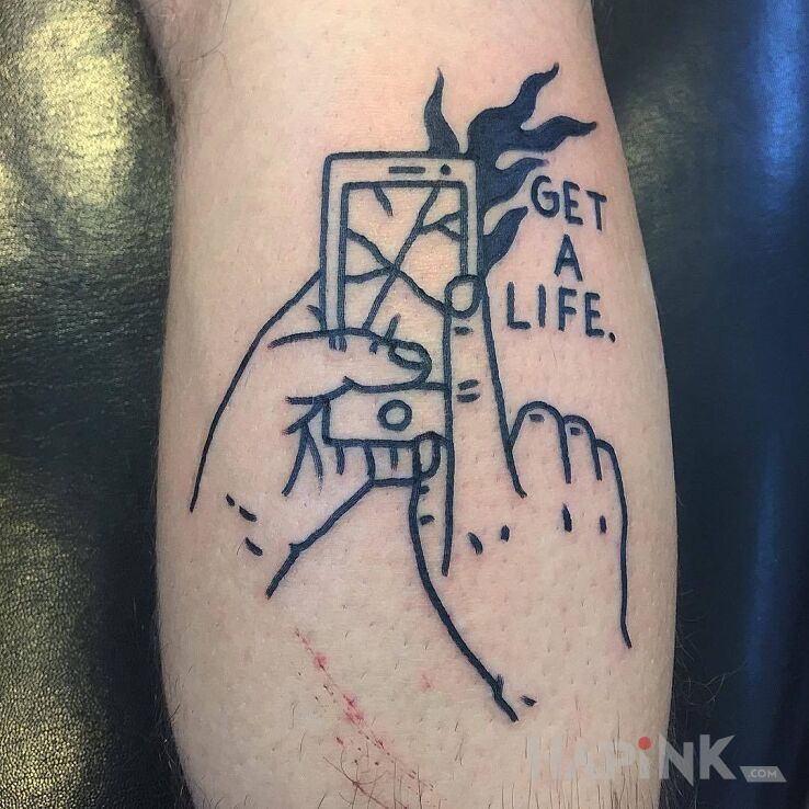 Tattoo Get a life. in lettering motif and ignorant style on the calf