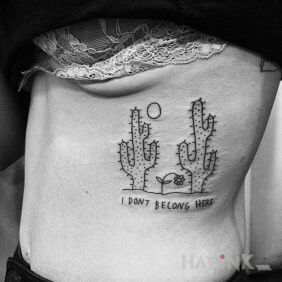 Tattoo I don't fit here on the ribs motif: lettering style: ignorant