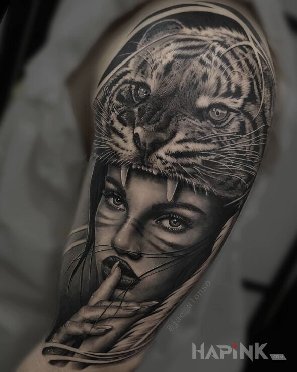 Tattoo Tygrysia mama in faces motif and realistic style on the upper arm