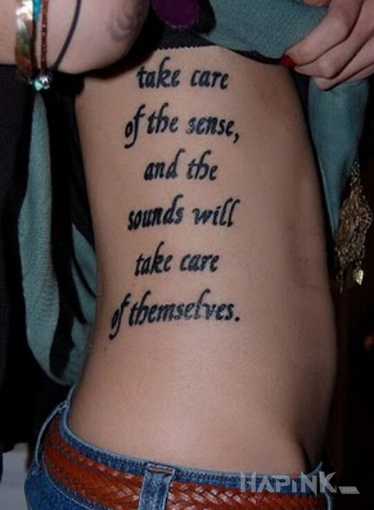 Tattoo Tatuaż na żebrach in lettering motif on the ribs