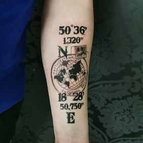 Tattoo Azimuth globe world map on the forearm motif: black and gray style: graphic / illustrative