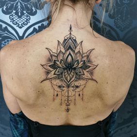 Tattoo Mandala on the back motif: black and gray style: graphic / illustrative