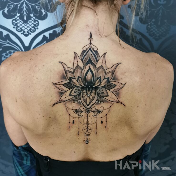 Tattoo Mandala in flowers motif and graphic / illustrative style on the back