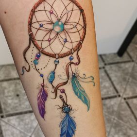 Tattoo Dreamcatcher on the forearm motif: objects style: realistic