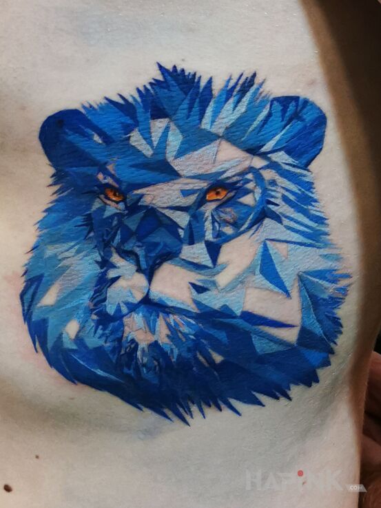 Tattoo Lew in animals motif and abstract style on the chest