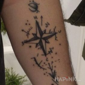 Tattoo Compass rose on the forearm motif: other style: graphic / illustrative