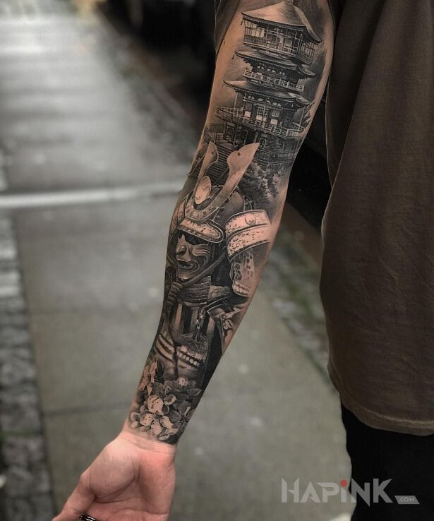 Tattoo Samurai in characters motif and realistic style on the upper arm