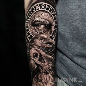 Tattoo Blinded Odin on the forearm motif: black and gray style: realistic