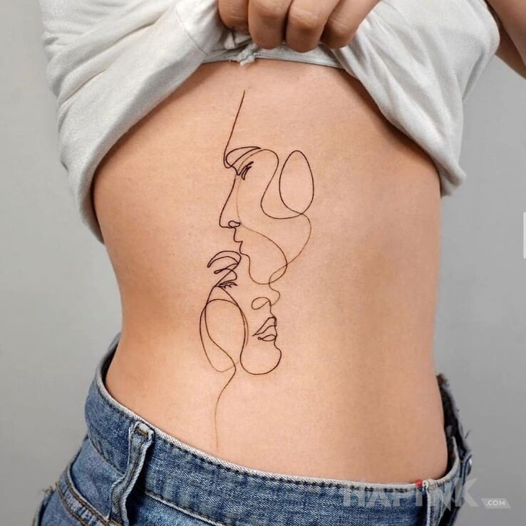 Tattoo Pocałunek w czoło in faces motif and contour / linework style on the ribs
